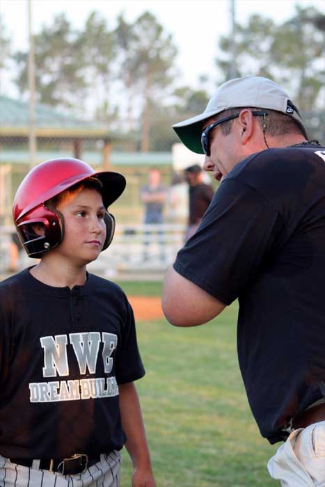 Tanner gets batting tips from Coach Preston