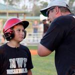 Tanner gets batting tips from Coach Preston