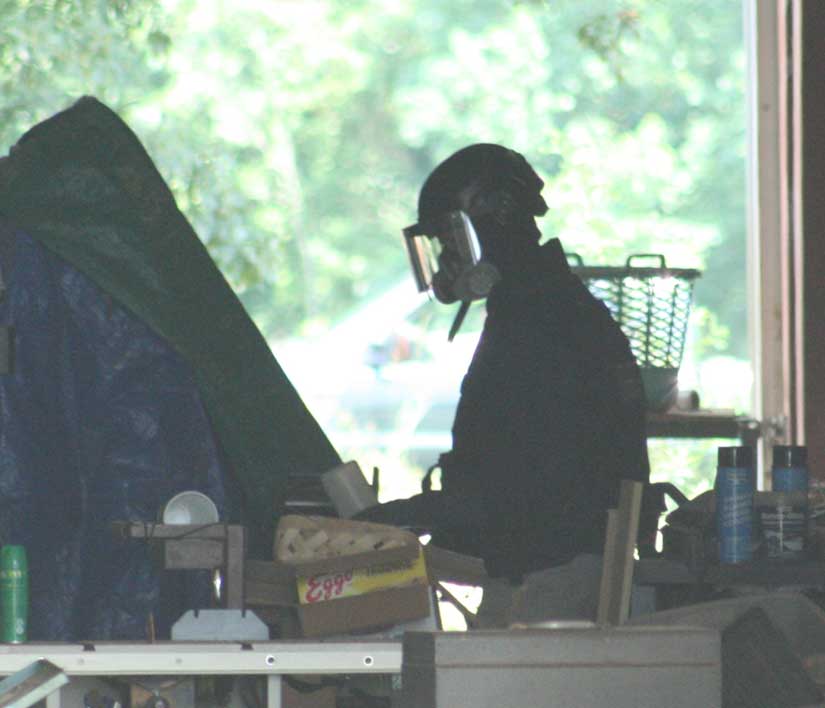 Bomb Technician Holds Container
