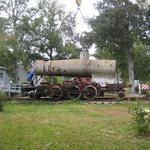 The front of the boiler lifts first. It appears as if the man in front is trying to hold it down.
