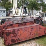  The water tank is safely placed onto crossties to await its turn at repair, sandblasting and painting.