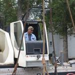  The crane operator takes his work quite seriously.