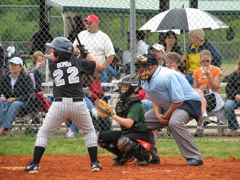 Batter Ethan Bomba, Catcher Zach Holland and umpire Josh Turner