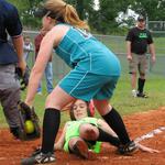Reagan Bell NWE girs softball successfully slides into home plate as Mariah Albritton attempts the out