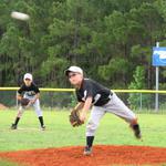 Zach Payne delivers with Devin Stabler covering center field